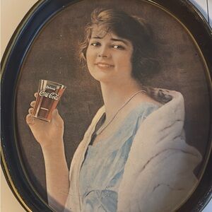 Coca-Cola Hand Holding Glass Art with Blue and Brown Accents